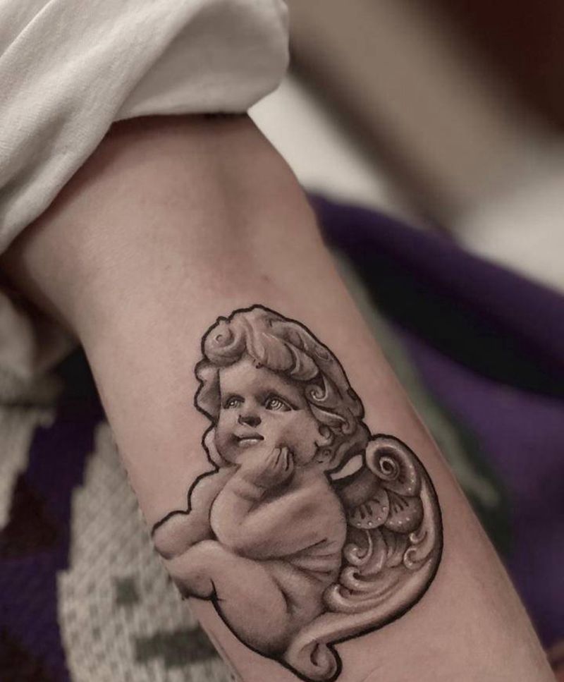 一刺-闰土纹身图片_欧美写实纹身图案