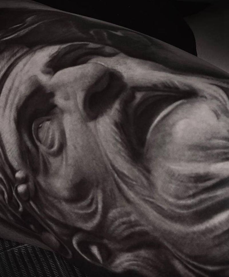 一刺-闰土纹身图片_欧美写实纹身图案