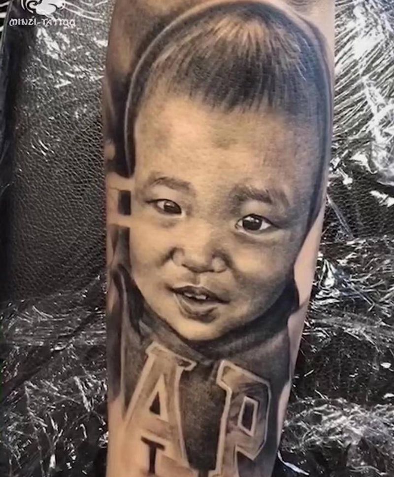 宝宝肖像纹身图片_手臂欧美写实纹身图案