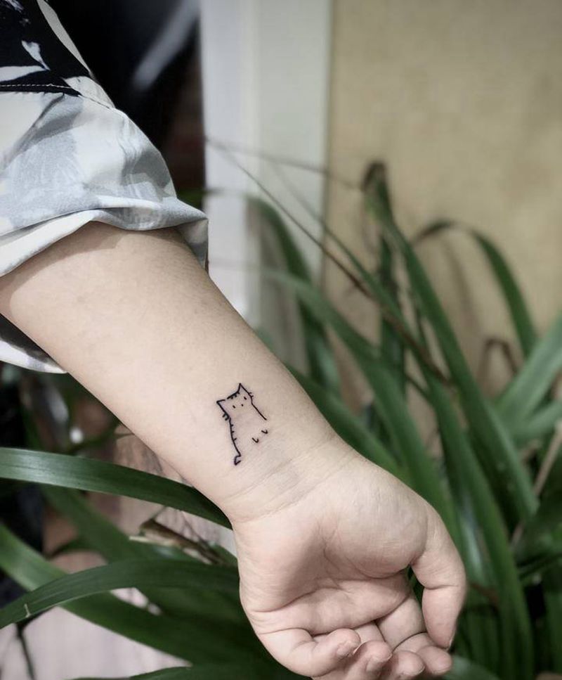小猫纹身图片_手臂纹身图案