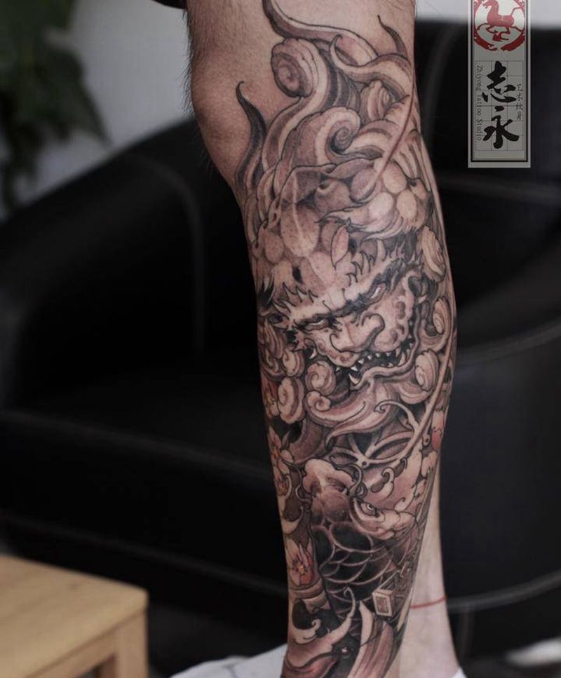 唐狮纹身图片_腿部新传统唐狮鲤鱼纹身图案