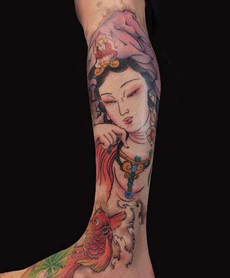 观音纹身图片_腿部新传统水墨观音福娃纹身图案