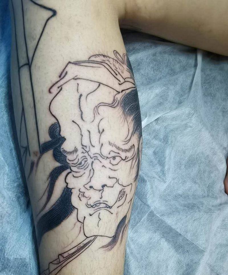 生首纹身图片_腿部新传统纹身图案