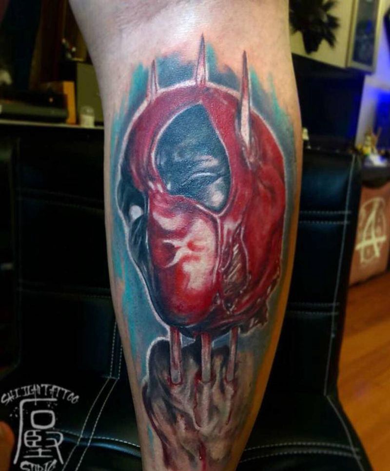 金刚狼VS死侍纹身图片_腿部欧美写实纹身图案