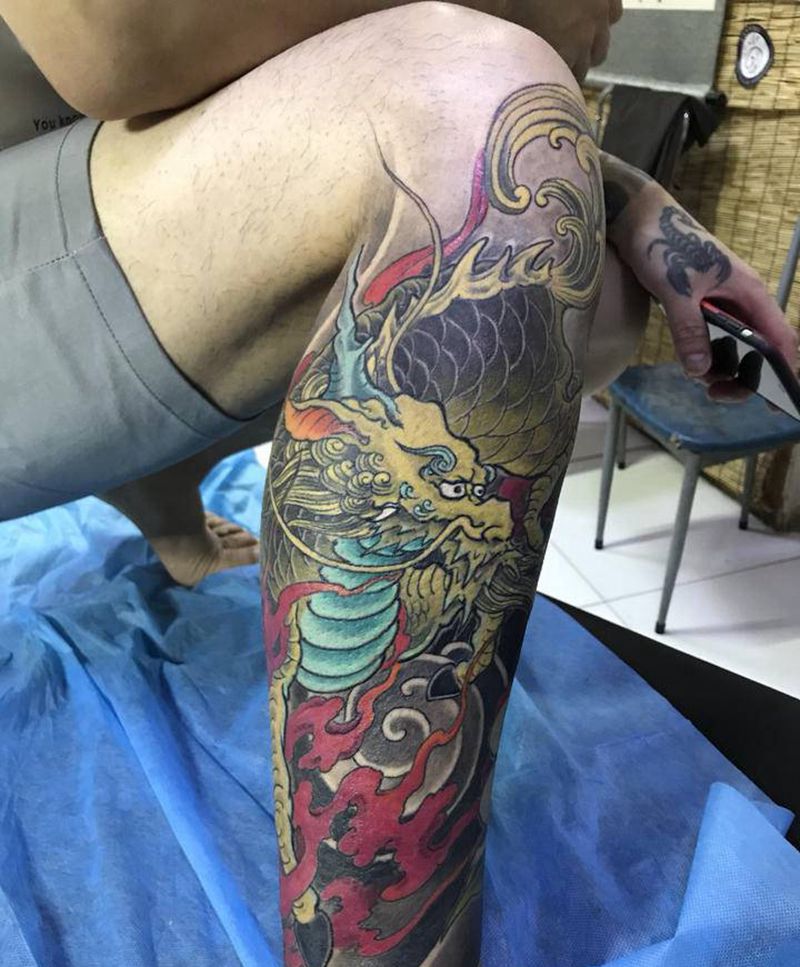 麒麟 牡丹纹身图片_腿部新传统纹身图案