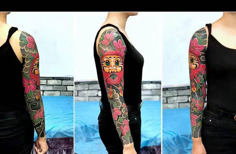 达摩蛋花臂纹身图片_手臂老传统纹身图案