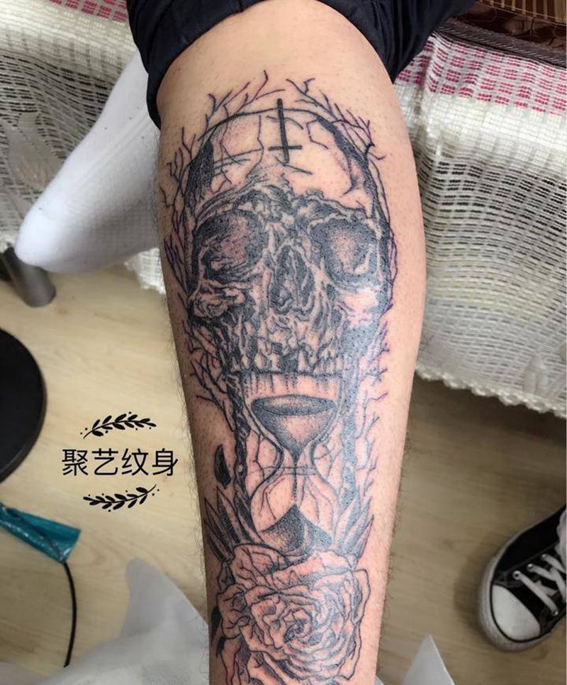 欧美骷髅沙漏花纹身图片_成品欧美腿部鬼神纹身图案