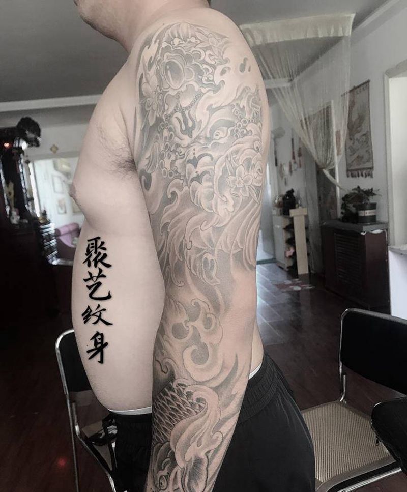 覆盖疤痕 象神鲤鱼花纹身图片_手臂纹身图案