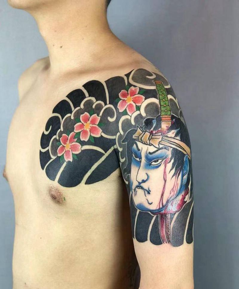 生首半甲纹身图片_胸部手臂老传统纹身图案