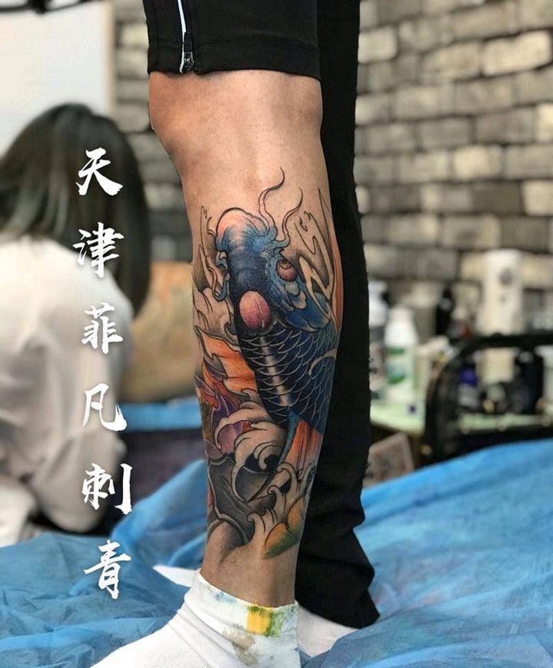 小腿鱼纹身图片_腿部纹身图案