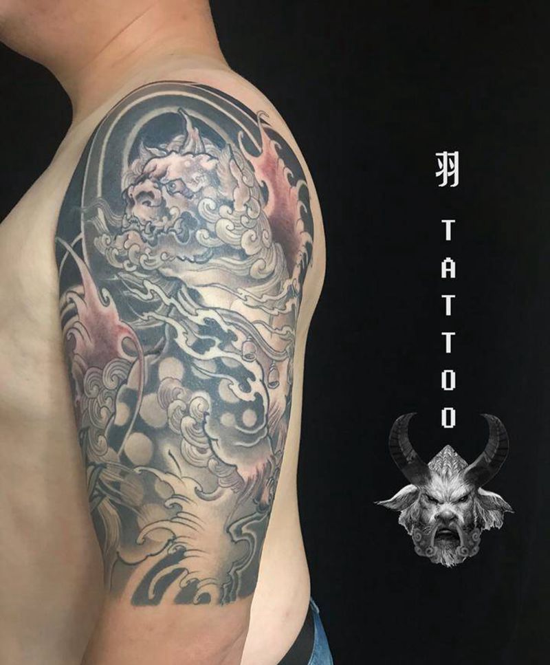 唐狮踩达摩纹身图片_