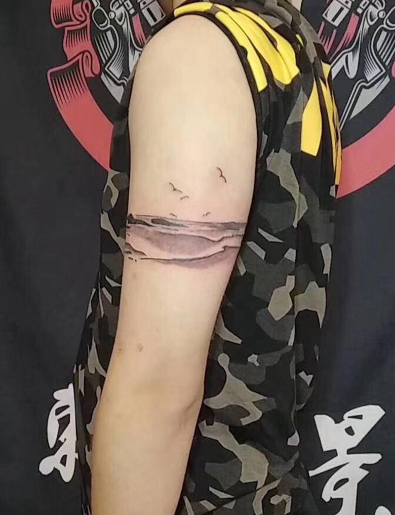 海平面纹身图片_手臂水墨纹身图案