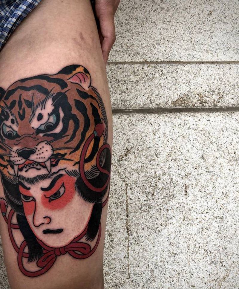 生首纹身图片_腿部老传统纹身图案