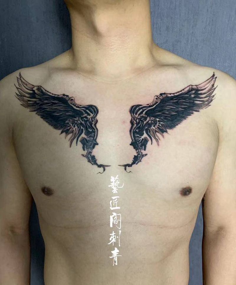 翅膀纹身图片_胸部纹身图案