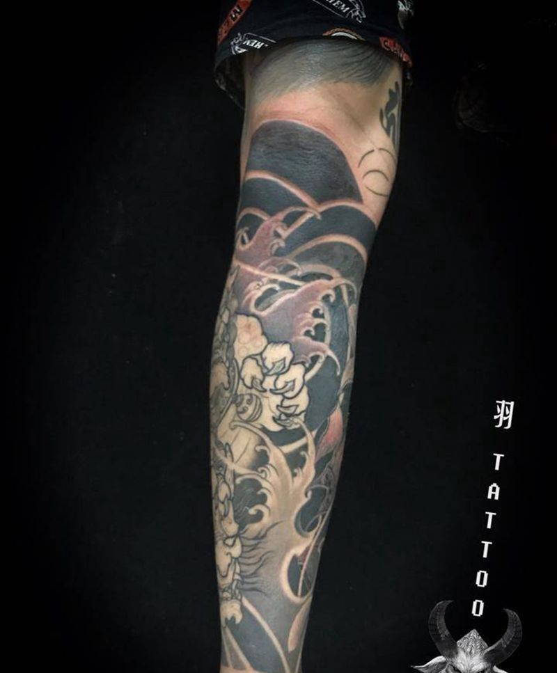 包小腿唐狮荷花未完纹身图片_