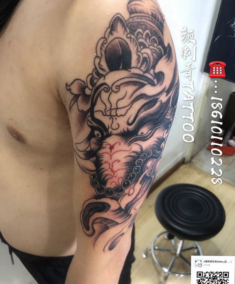 大臂象神纹身图片_手臂纹身图案