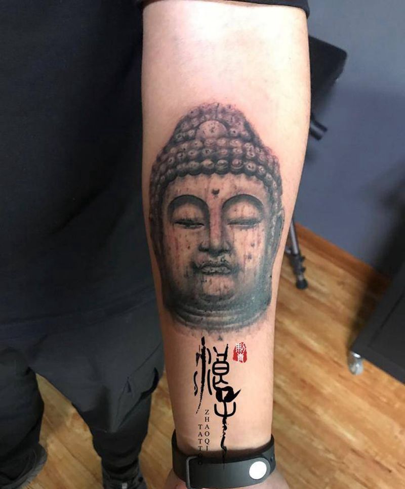 石雕佛头纹身图片_手臂新传统佛，石雕纹身图案