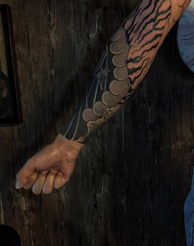 未完纹身图片_手臂老传统纹身图案