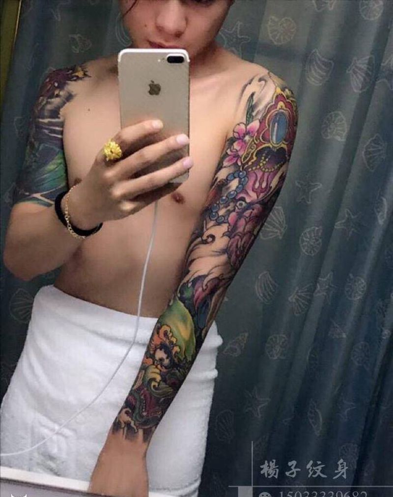 象神唐狮花臂纹身图片_手臂纹身图案