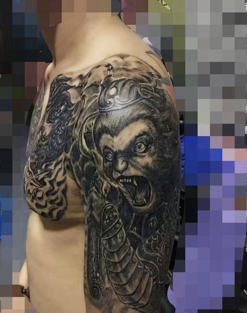 凶而慈悲纹身图片_肩部胸部佛人物唐狮纹身图案