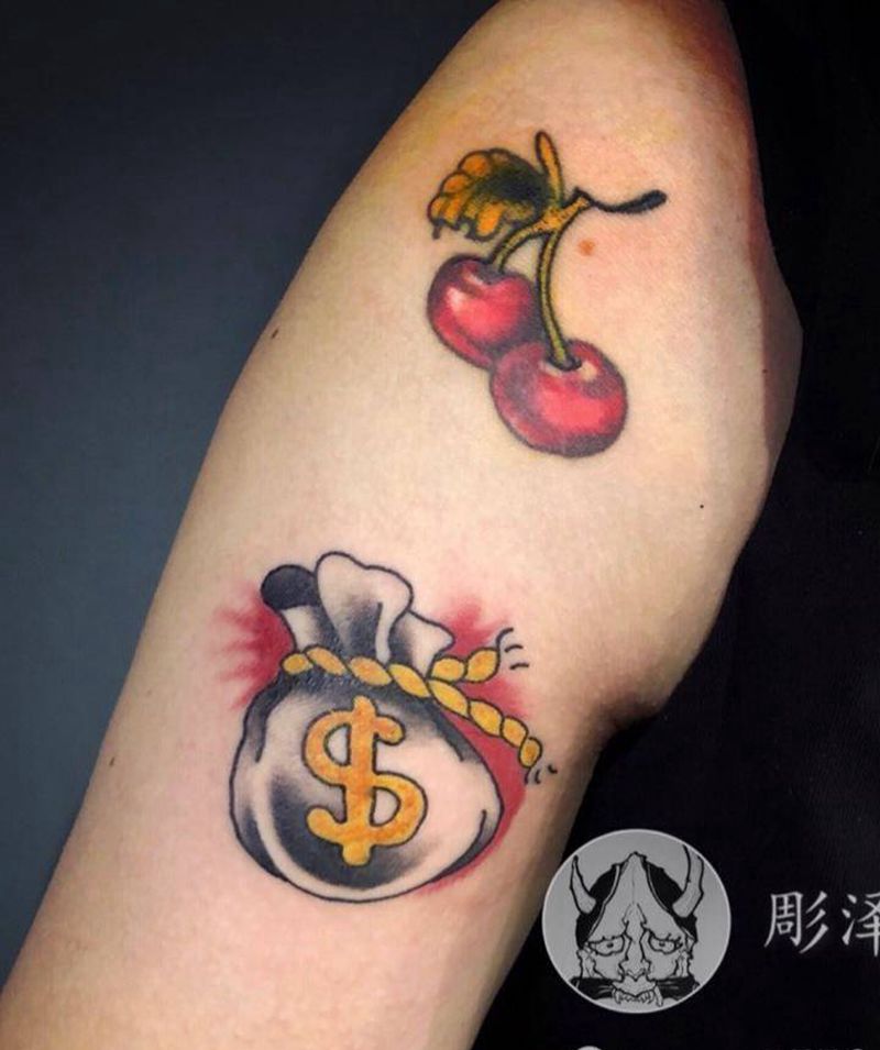 樱桃。钱袋纹身图片_手臂Old School纹身图案