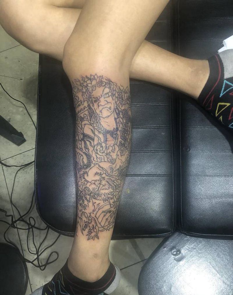 不动明王纹身图片_腿部纹身图案