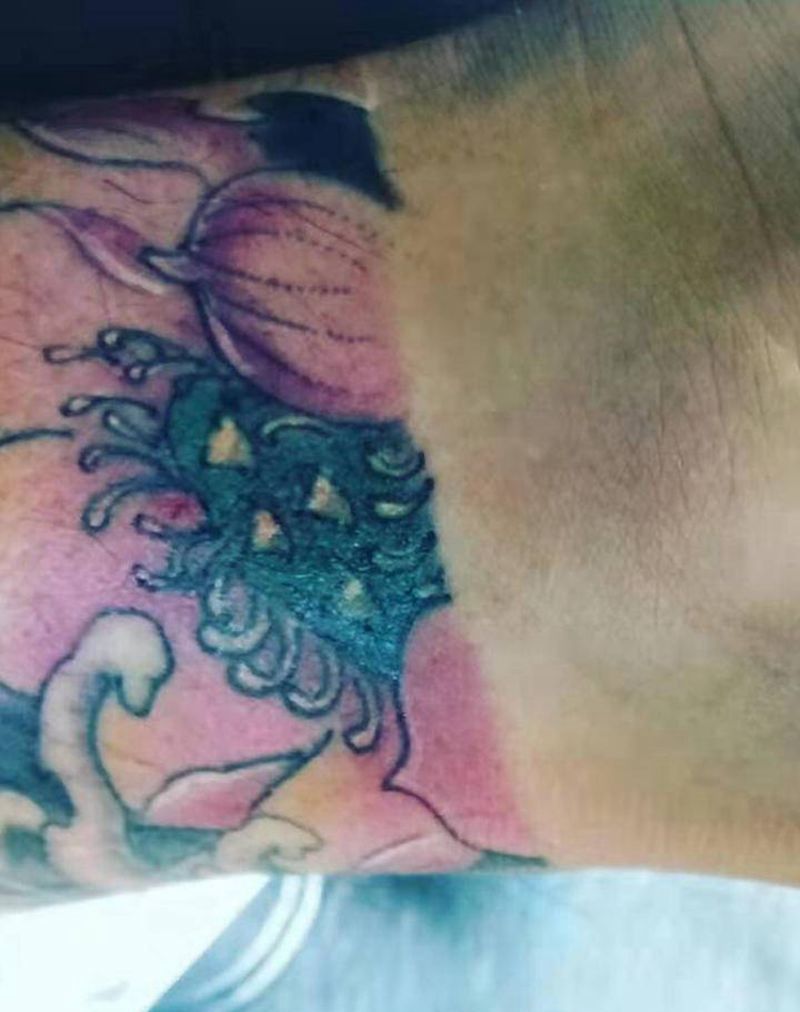 荷花鱼纹身图片_腿部纹身图案