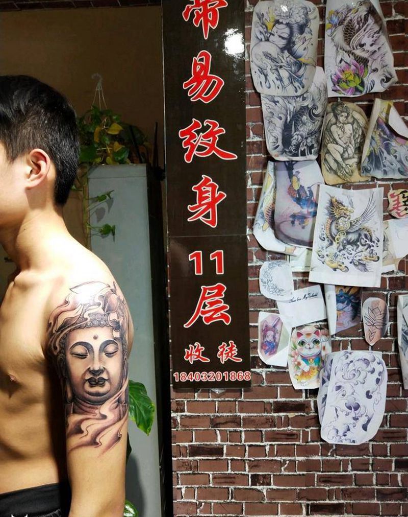 佛头纹身图片_手臂新传统佛头纹身图案