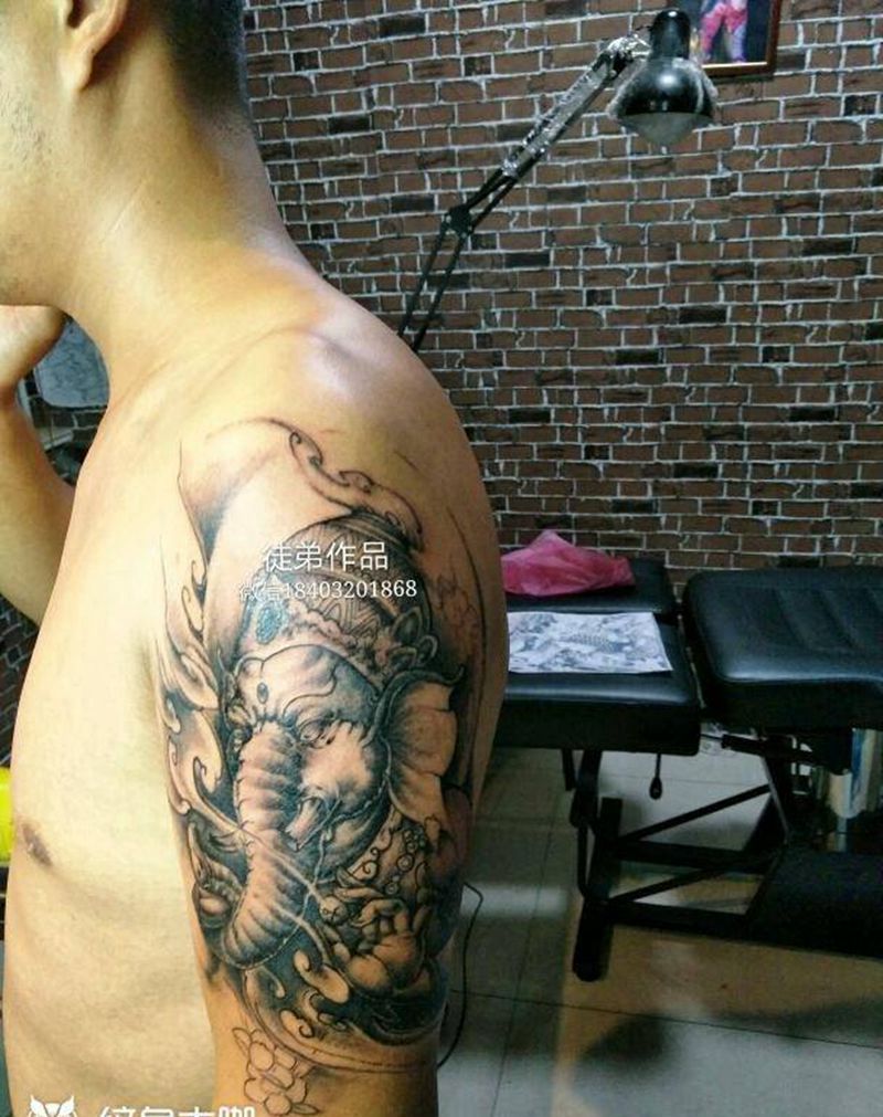 象神纹身图片_肩部传统人物鬼神纹身图案