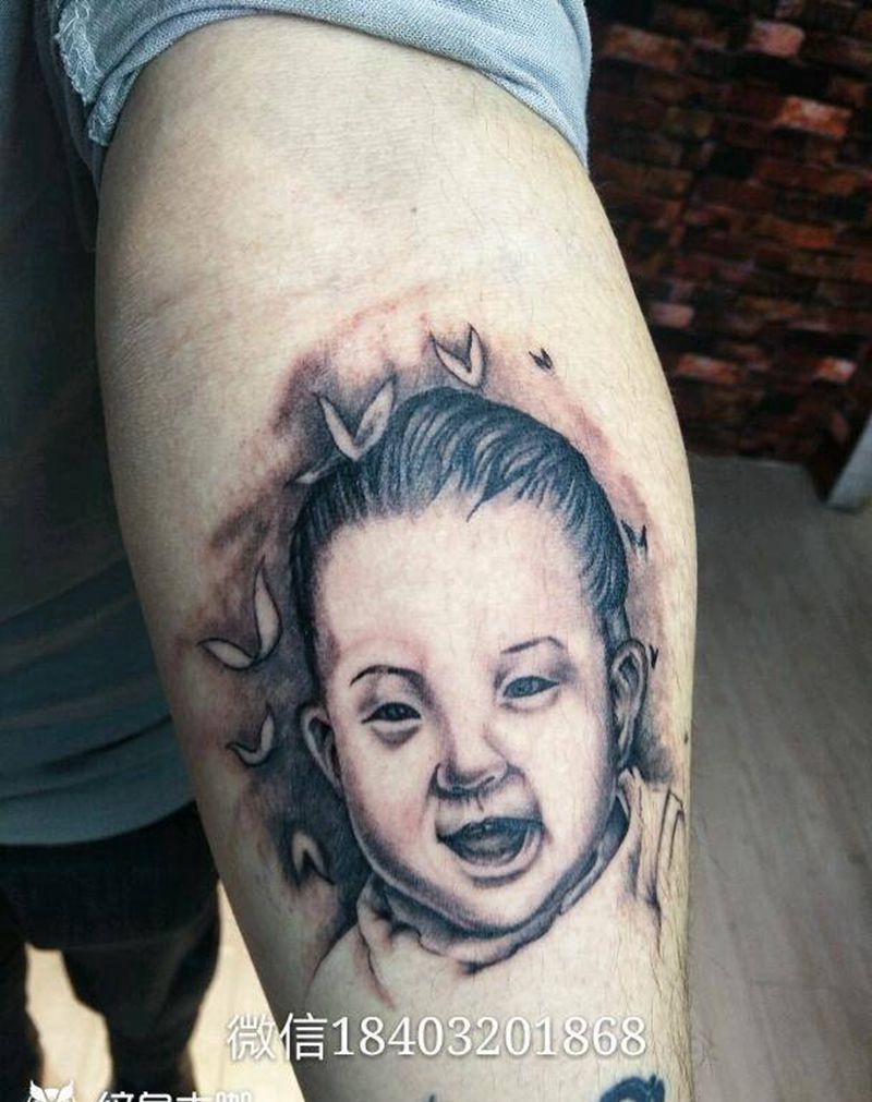小宝贝纹身图片_手臂写实人物成品纹身图案