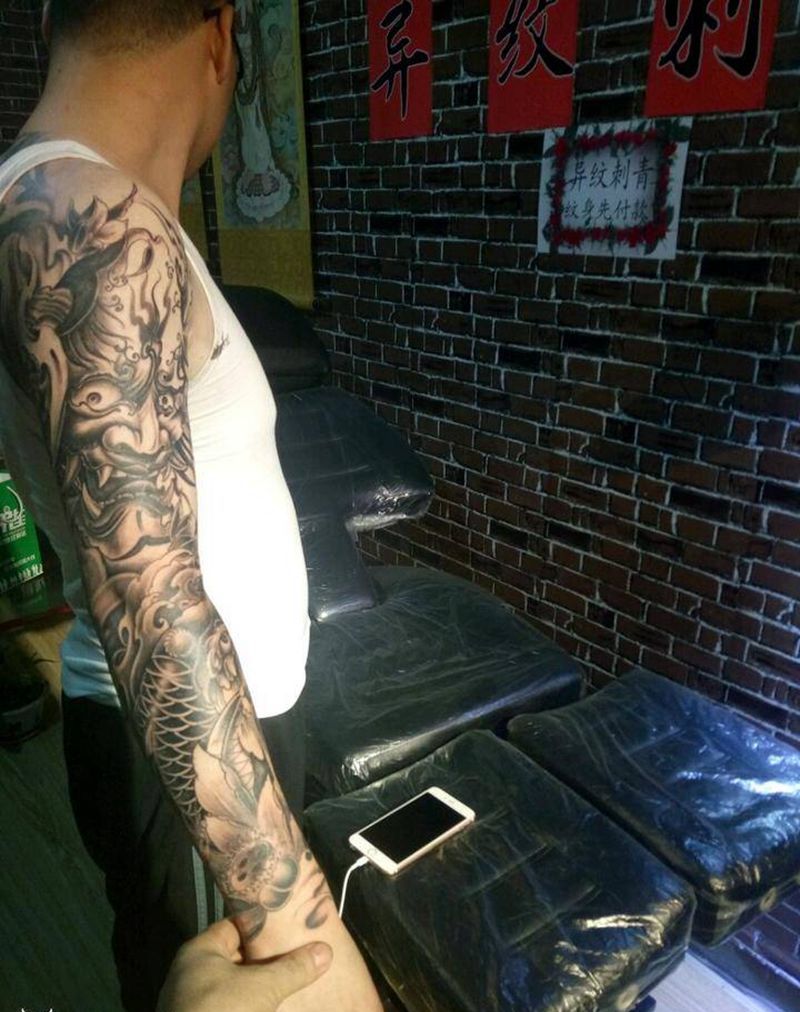 般若鱼花臂纹身图片