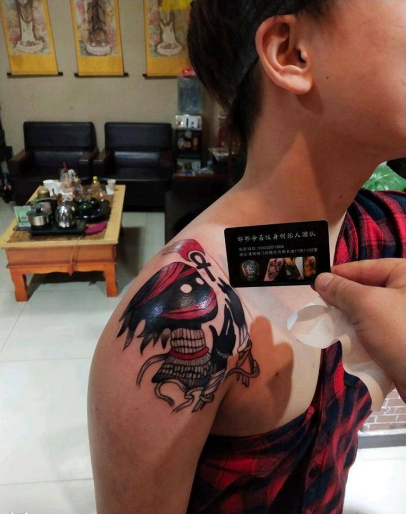 黑脸娃娃纹身图片_肩部New School纹身图案
