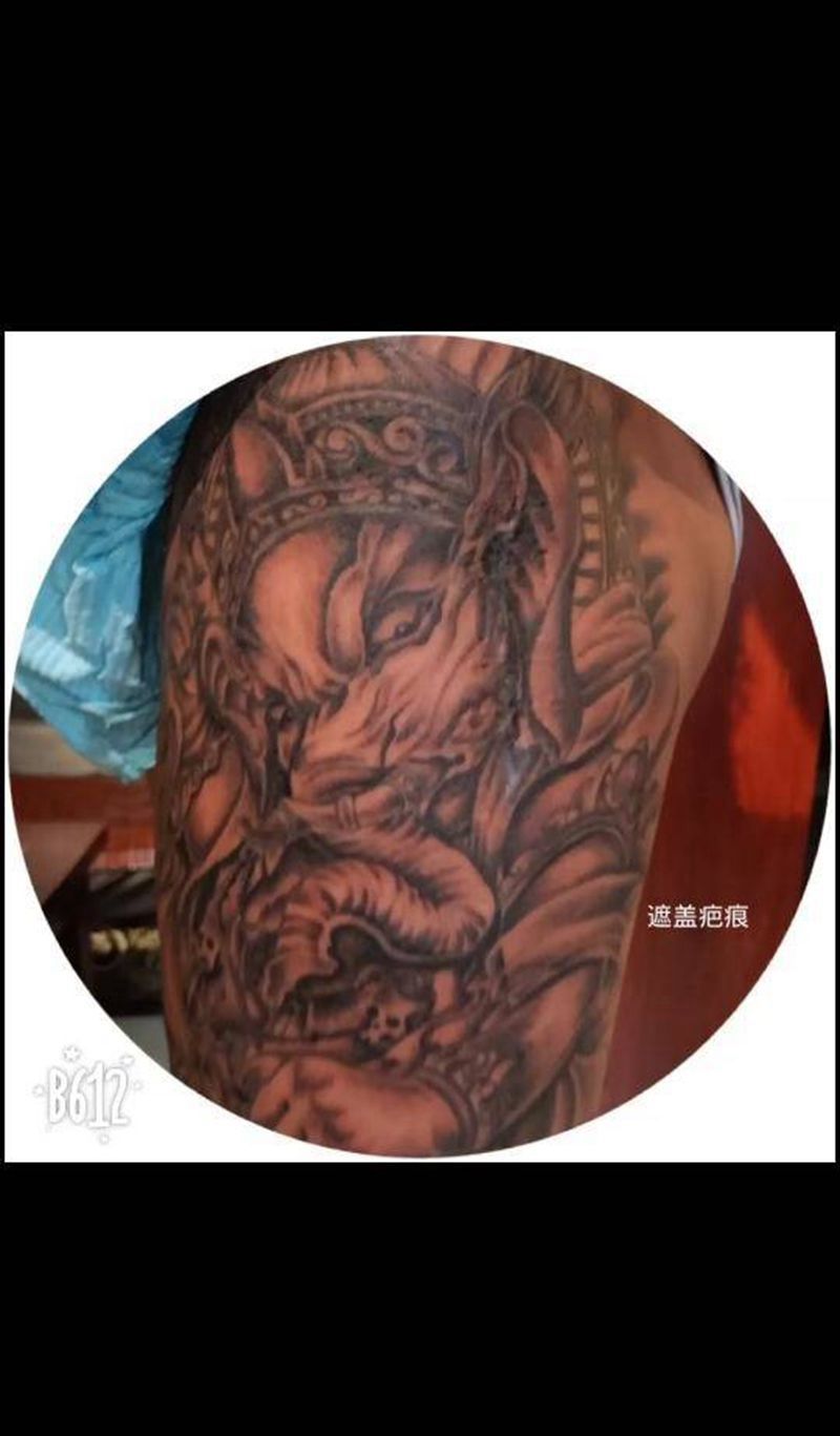 象神遮盖大腿疤痕纹身图片