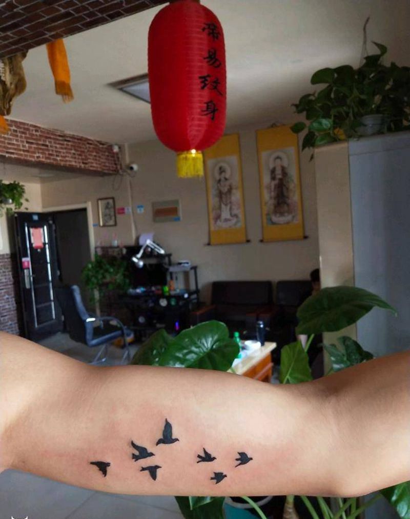 北大青鸟毕业的纹身图片_手臂欧美几何动物图腾成品手稿纹身图案