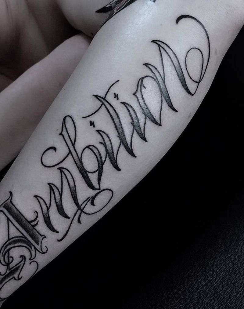Ambition纹身图片_手臂花体字纹身图案