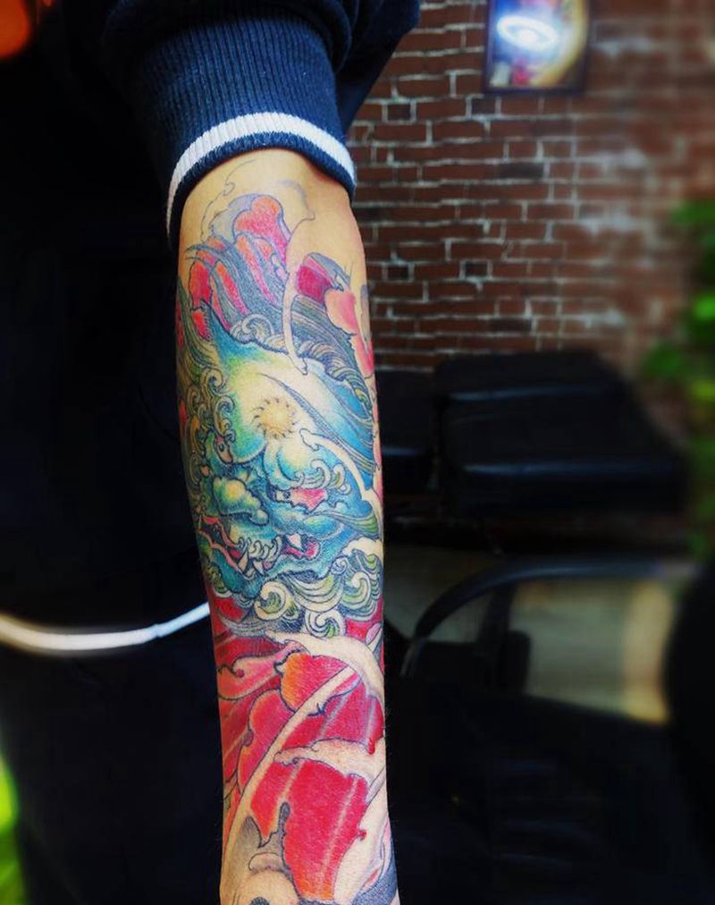 唐狮牡丹纹身图片_手臂新传统纹身图案