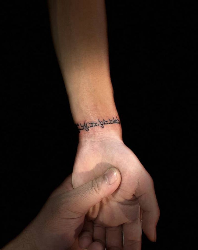 梵文纹身图片_手臂花体字纹身图案