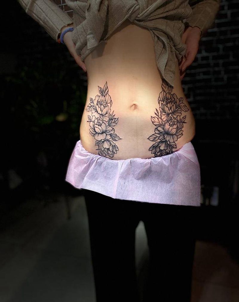 双花纹身图片_腹部点刺纹身图案