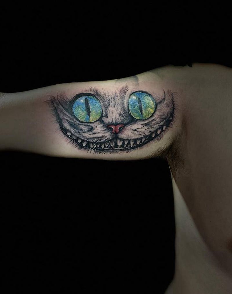 爱丽丝的猫纹身图片_手臂纹身图案