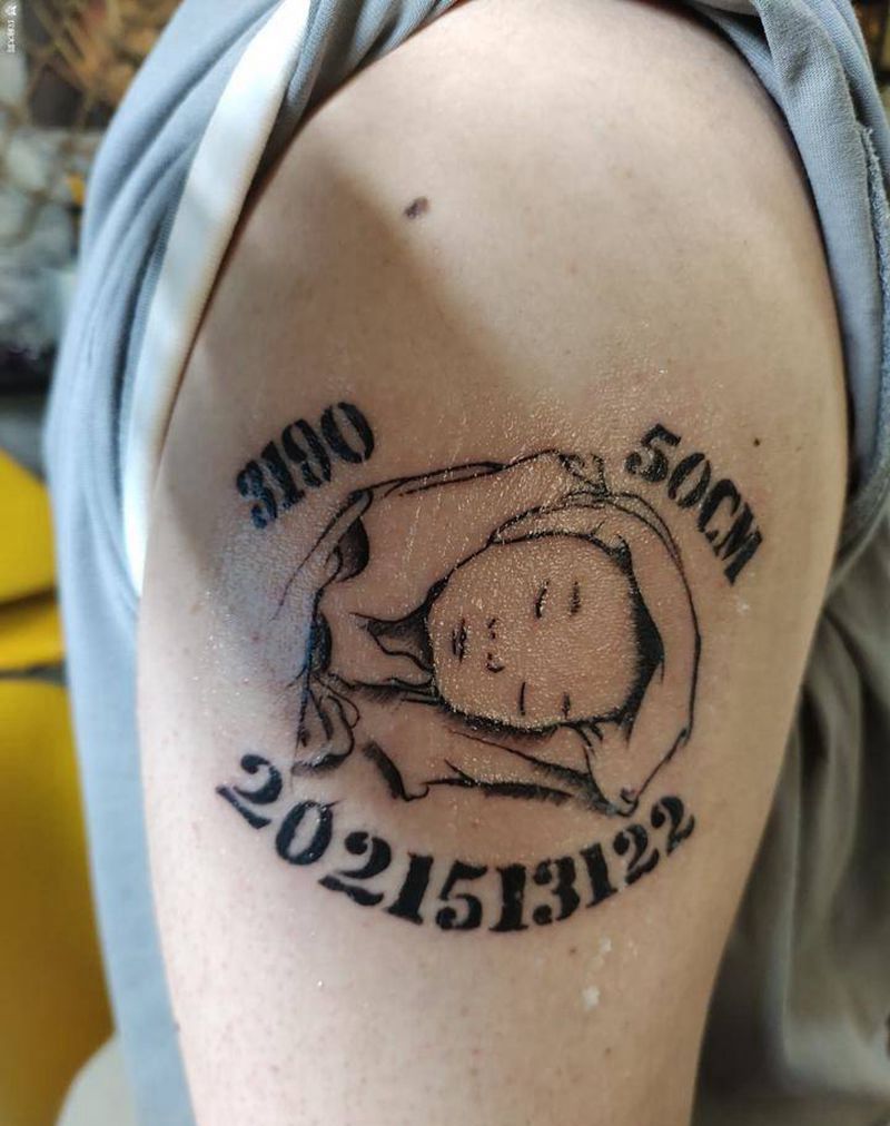 宝宝纹身图片_手臂点刺孩子头像纹身图案