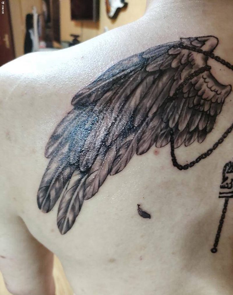 一念纹身图片_背部新传统翅膀纹身图案