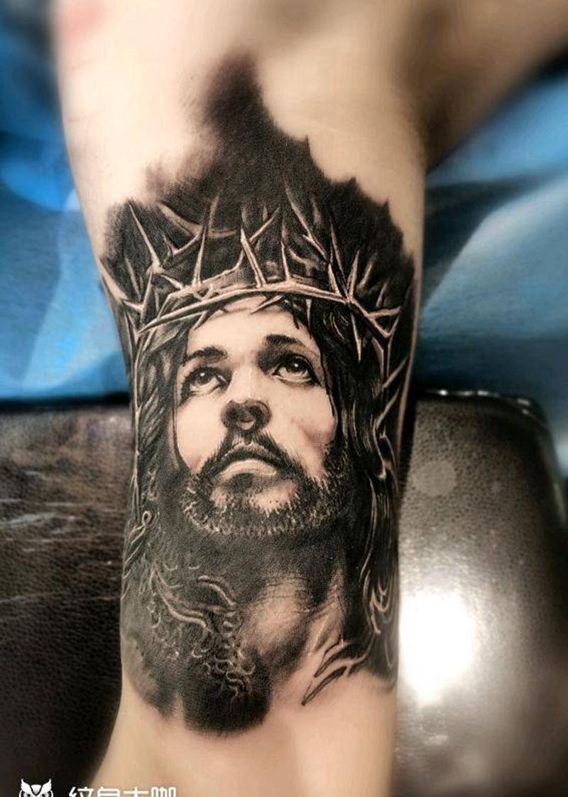 耶稣纹身图片_手臂欧美写实纹身图案