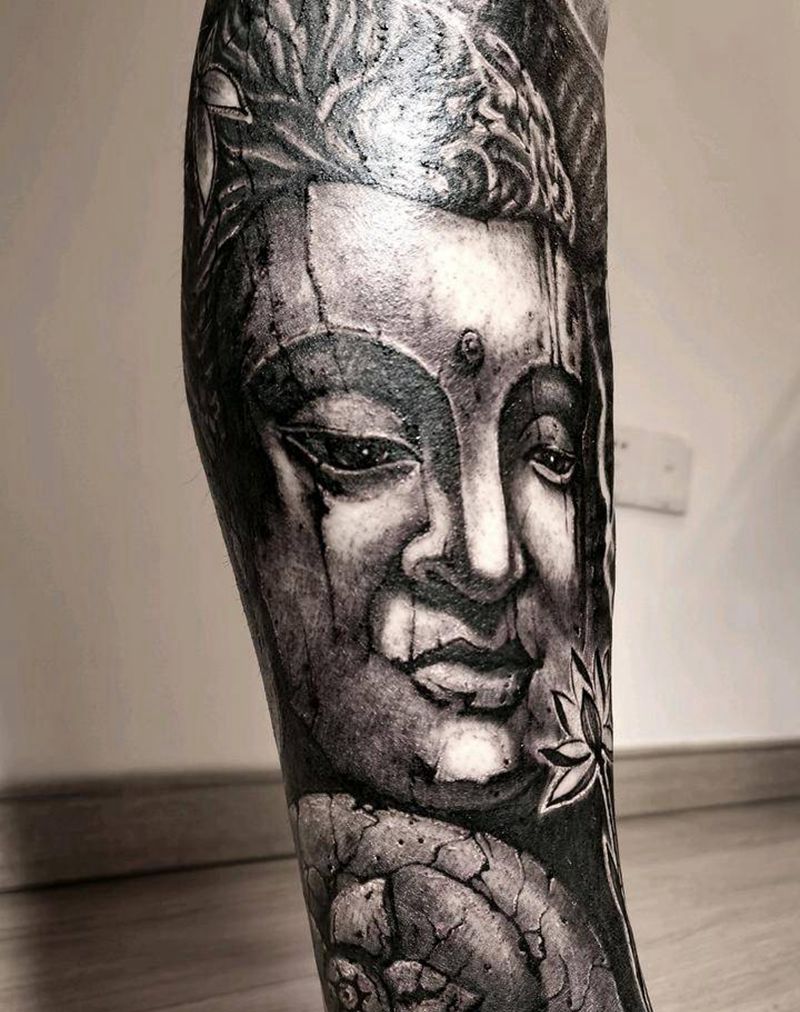 石雕佛头纹身图片_腿部欧美写实纹身图案