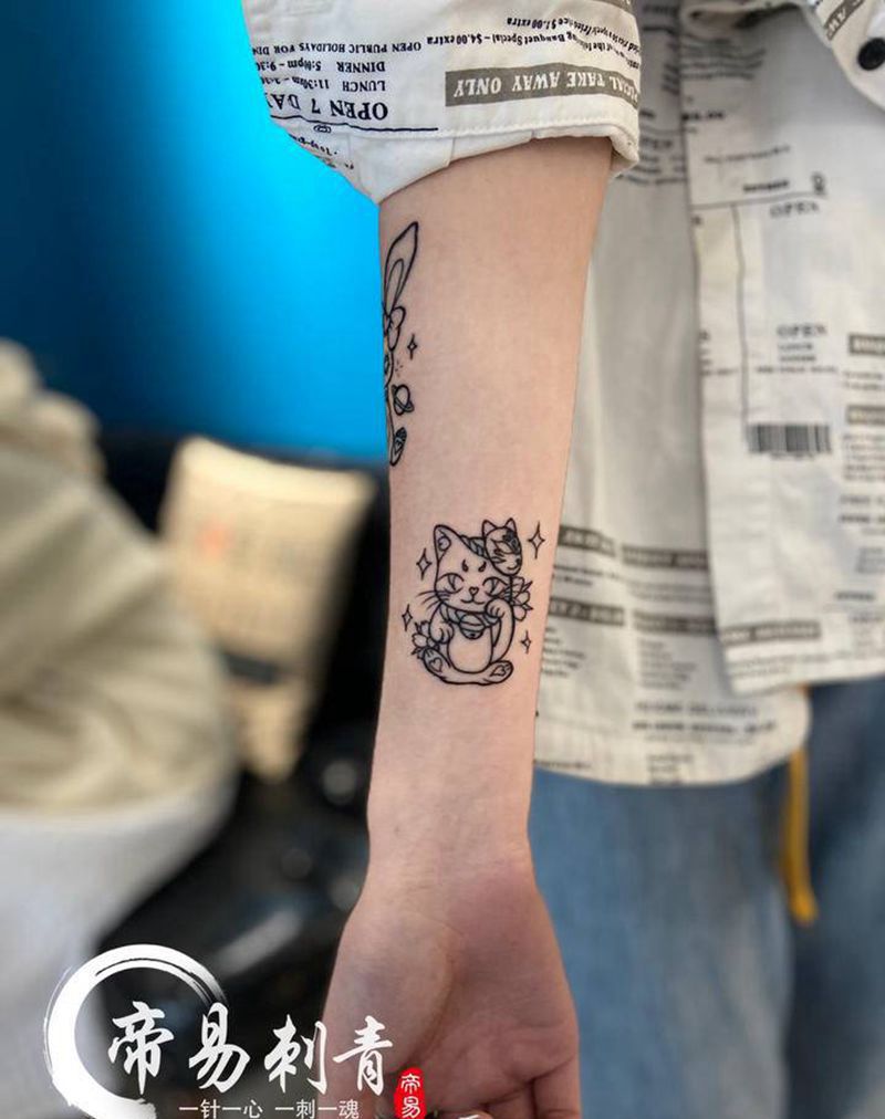 卡通纹身图片_手臂纹身图案