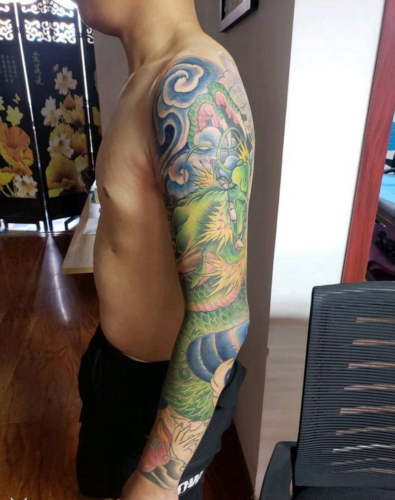 花臂龙纹身图片_手臂老传统纹身图案