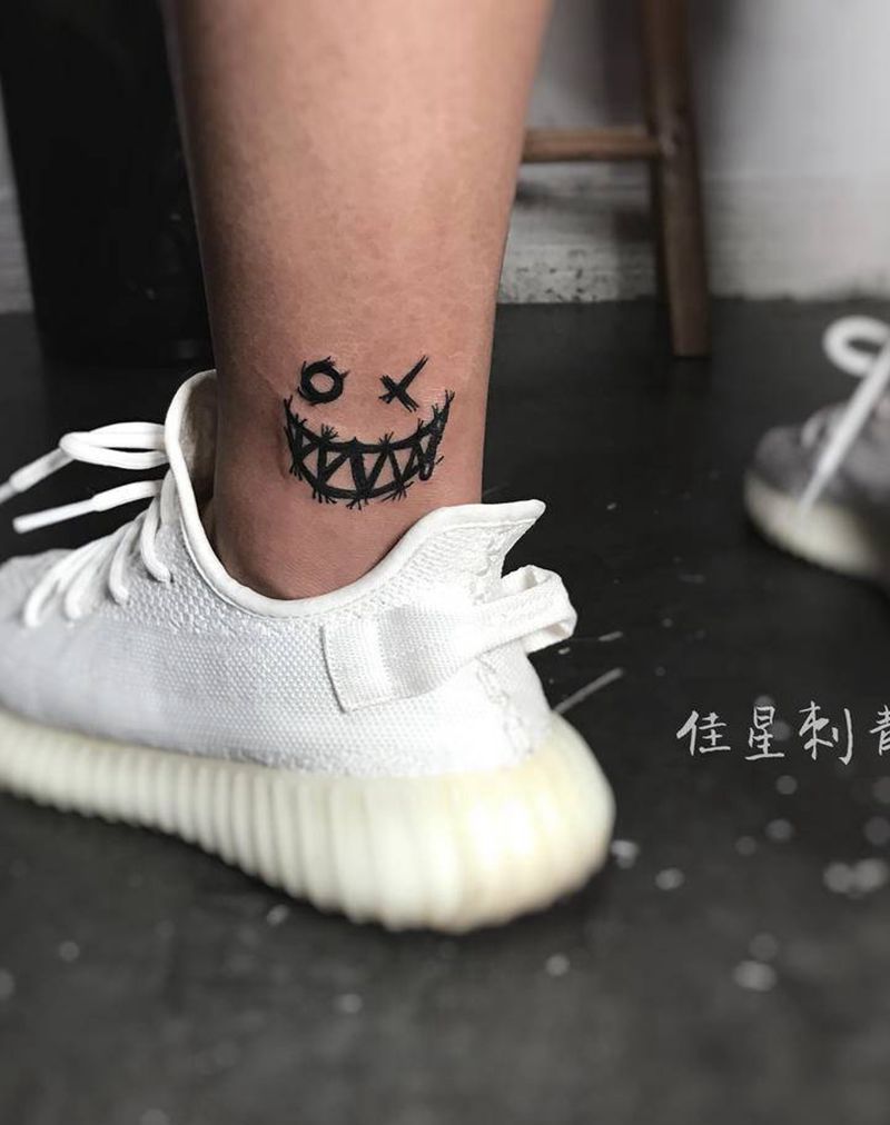 小表情纹身图片_腿部图腾纹身图案