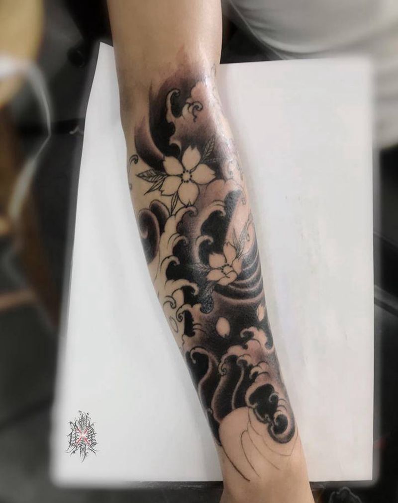 浪臂未完纹身图片_手臂纹身图案