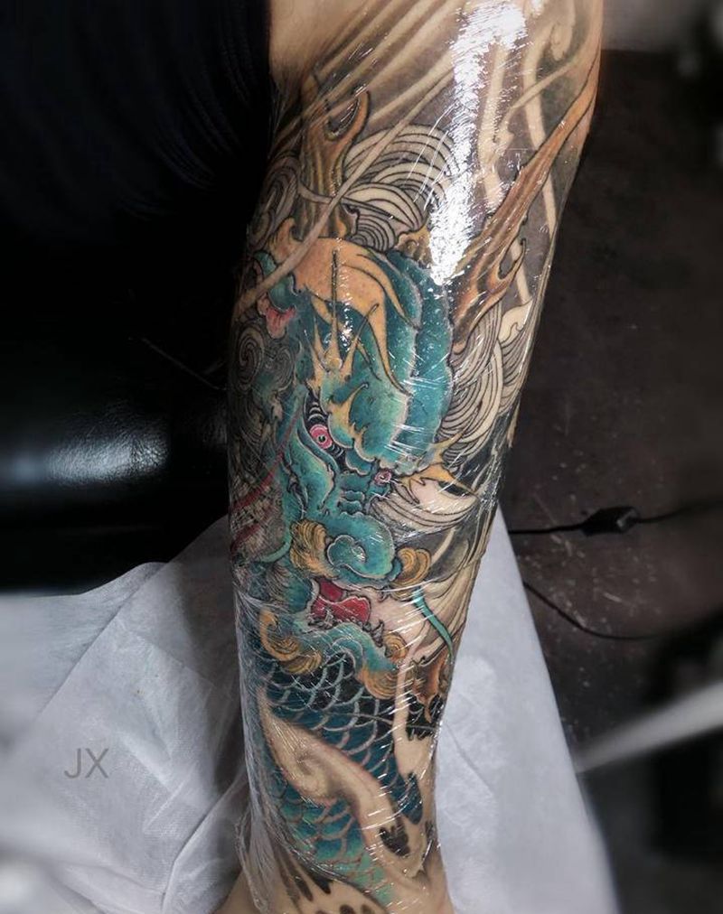 麒麟未完纹身图片_腿部新传统纹身图案