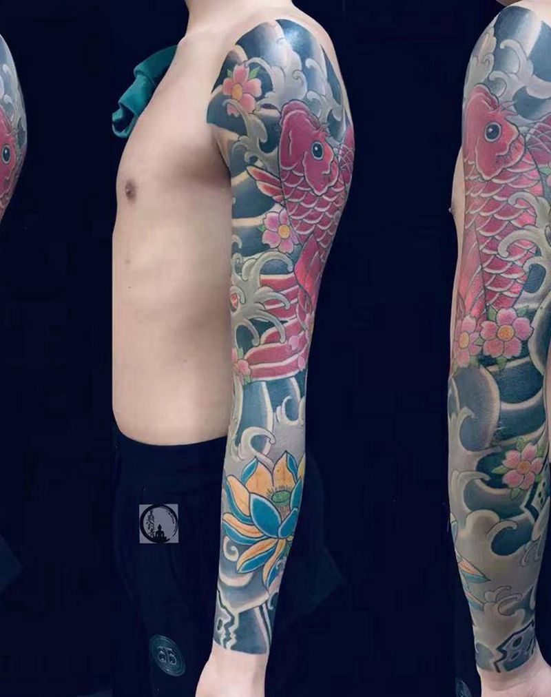 老传统花臂纹身图片_手部手臂老传统鱼纹身图案