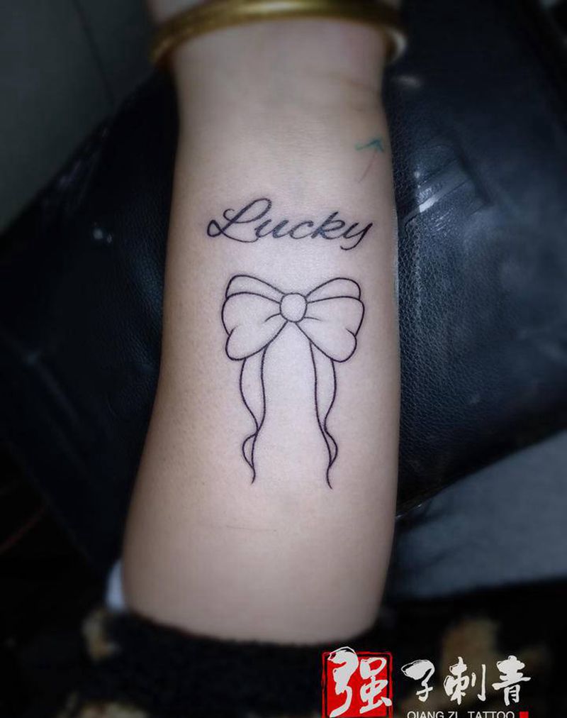 幸运蝴蝶结纹身图片_手臂小清新纹身图案